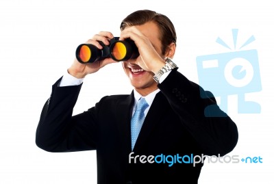 Man Looking Through Binoculars Stock Photo