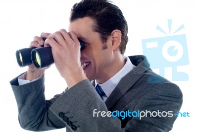 Man Looking Through Binoculars Stock Photo