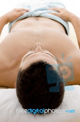 Man Lying Down For Spa Treatment Stock Photo