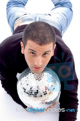 Man Lying With Disco Ball Stock Photo