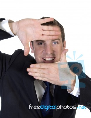 Man Making Frame Shape With Fingers Stock Photo