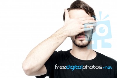 Man Making See No Evil Gesture Stock Photo