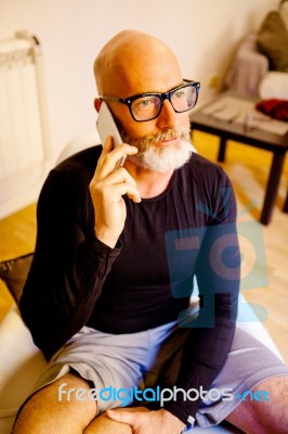 Man Middle-aged Talking On His Smartphone Stock Photo