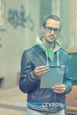 Man On Street Use Ipad Tablet Computer Stock Photo