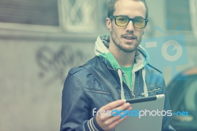 Man On Street Use Ipad Tablet Computer Stock Photo