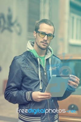 Man On Street Use Ipad Tablet Computer Stock Photo