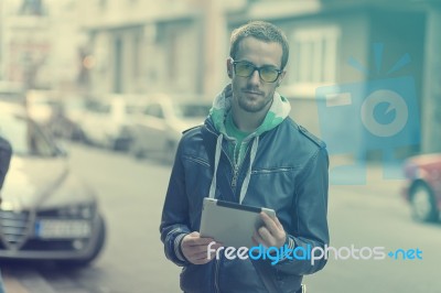 Man On Street Use Ipad Tablet Computer Stock Photo