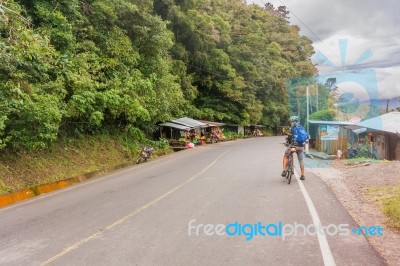 Man, On The Bicycle On The Road In Nicaragua Mountains Stock Photo