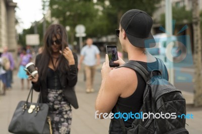 Man Photographing Girl On Street Stock Photo