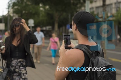 Man Photographing Girl On Street Stock Photo