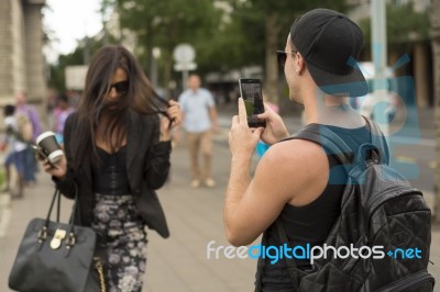 Man Photographing Girl On Street Stock Photo