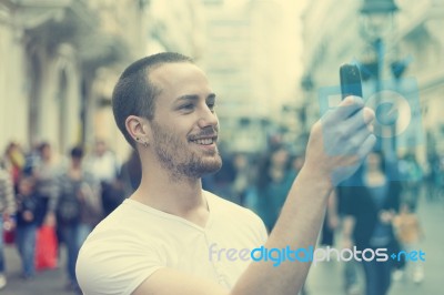 Man Photographing With Cell Phone Stock Photo