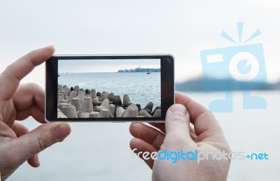 Man Photographs A Mobile Phone Stock Photo