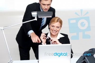 Man Pointing Finger At Laptop Screen Stock Photo