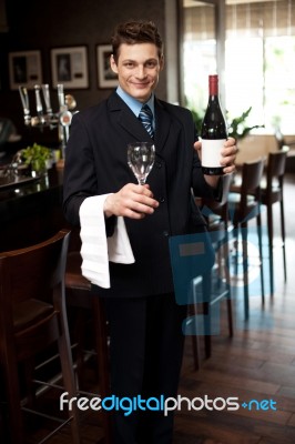 Man Posing With A Bottle Of Wine Stock Photo