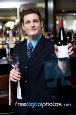 Man Posing With A Bottle Of Wine Stock Photo