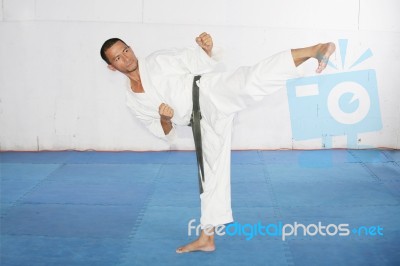 Man Practicing Martial Arts At The Gym Stock Photo