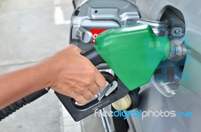 Man Pumping Gas In Tank Stock Photo