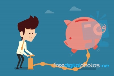 Man Pumping Money To Piggy Bank Stock Photo