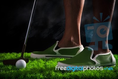 Man Putting Golf On Green Field Stock Photo