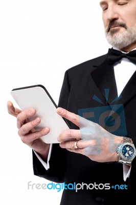 Man Reading News On His Tablet Pc Stock Photo