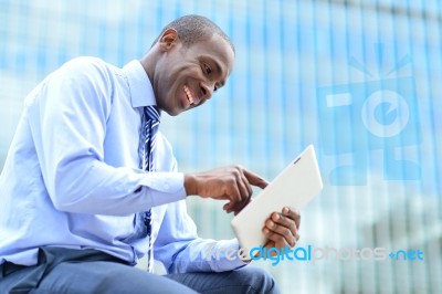 Man Reading News On His Tablet Pc Stock Photo