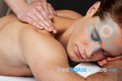 Man Receiving Relax Treatment At Spa Stock Photo