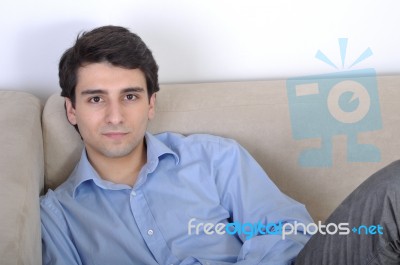 Man Relaxing On The Couch Stock Photo