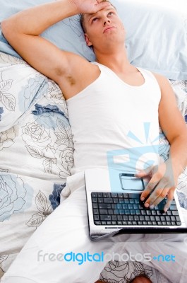 Man Resting With Laptop Stock Photo