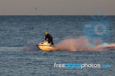 Man Riding A Jet Ski Off Dungeness Stock Photo