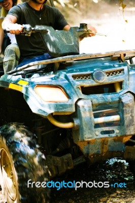 Man Riding Quad Bike Stock Photo