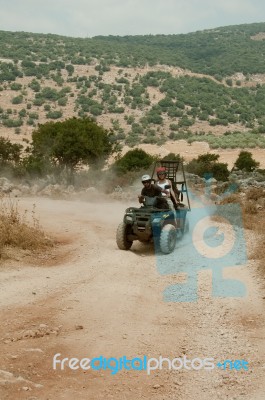 Man Riding Quad Bike Stock Photo