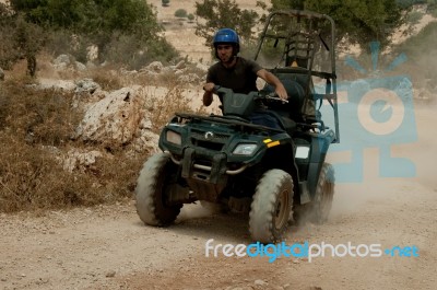 Man Riding Quad Bike Stock Photo