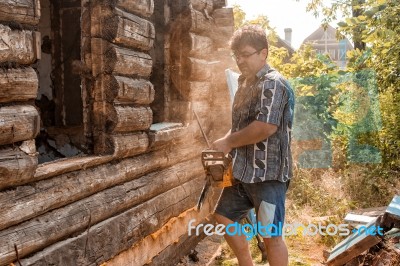 Man Sawing A Window Stock Photo