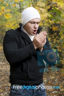 Man Shivering In Cold Winter Stock Photo