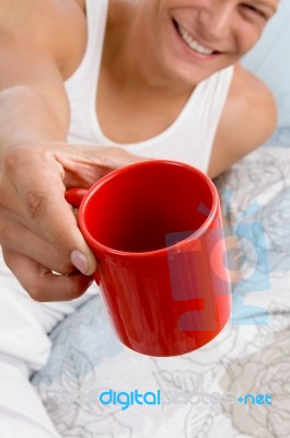 Man Showing Coffee Mug Stock Photo