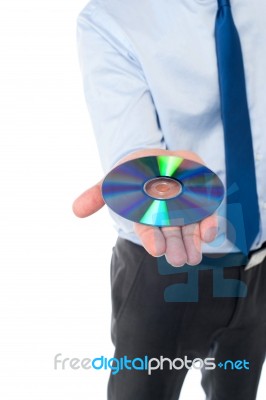 Man Showing Compact Disc, Cropped Image Stock Photo