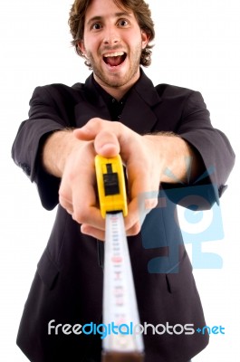 Man Showing Measuring Tape Stock Photo