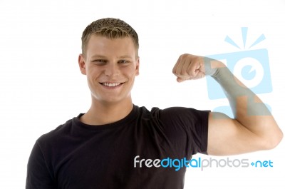 Man Showing Muscles Stock Photo