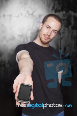 Man Showing Smartphone Stock Photo