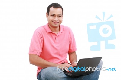 Man Sitting On Floor With Laptop Stock Photo