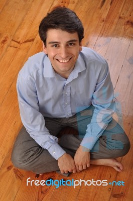 Man Sitting On The Floor Stock Photo