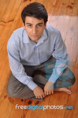 Man Sitting On The Floor Stock Photo