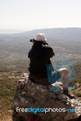 Man Sitting Outside And Enjoying In A View Stock Photo