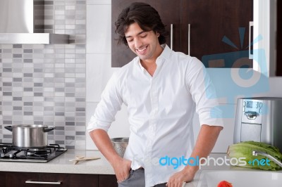 Man Smiling In Kitchen Stock Photo