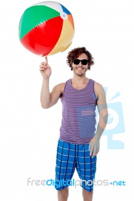 Man Spinning A Ball On His Finger Stock Photo