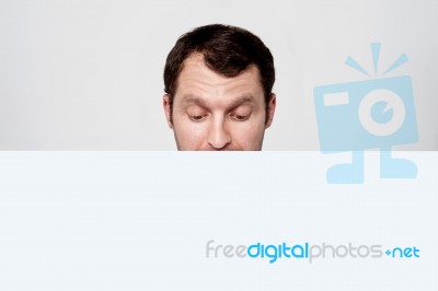 Man Standing Behind The Ad Board Stock Photo