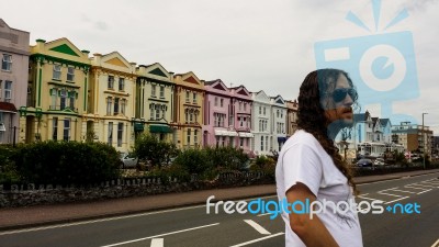 Man Standing In Front Of A Row Of Houses Stock Photo