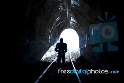 Man Standing In Train Tunnel Stock Photo