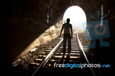 Man Standing In Train Tunnel Stock Photo